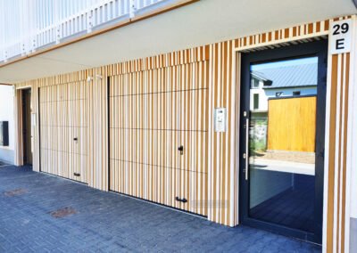 Bramy segmentowe obłożone drewnem Migas-Door